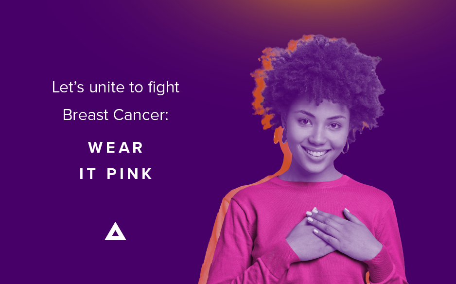 A smiling woman in a pink sweater with her hands over her heart, beside the text 'Let's unite to fight Breast Cancer: Wear It Pink' for Breast Cancer Awareness Month. | Abarca Health