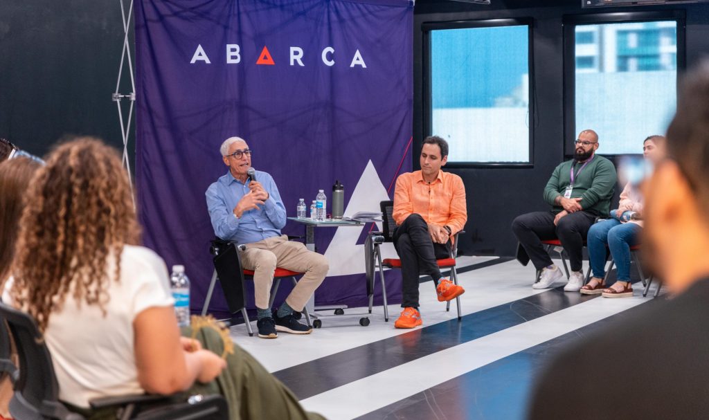 Jon Borschow speaking alongside Jason Borschow during an Oasis Connections session at Abarca Health, with attendees listening in a roundtable format