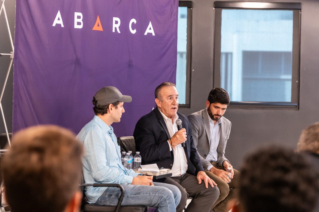 Hon. Manuel Cidre speaking during an Oasis Connections session at Abarca Health, joined by fellow panelists in a discussion on economic development in Puerto Rico